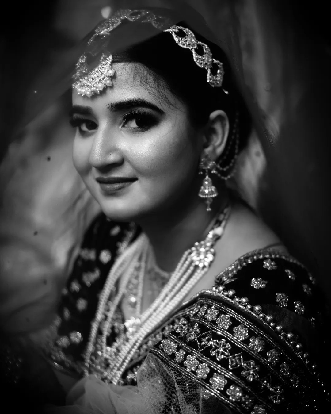 Black and white portrait of a bride in jewellery