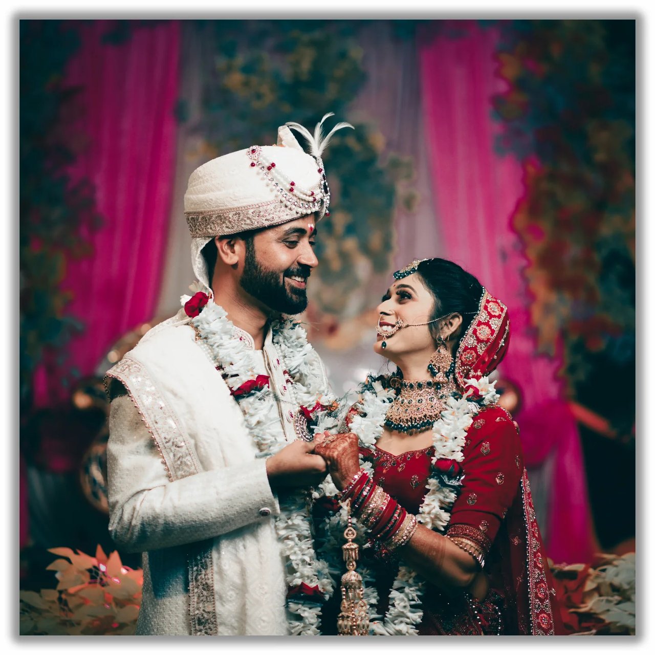 Bride and groom in garlands during the jaimala