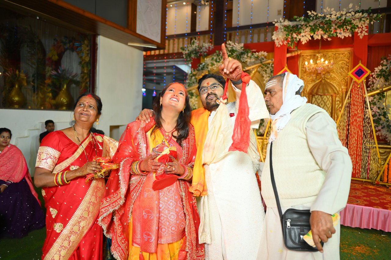 Relatives laugh together at the wedding venue